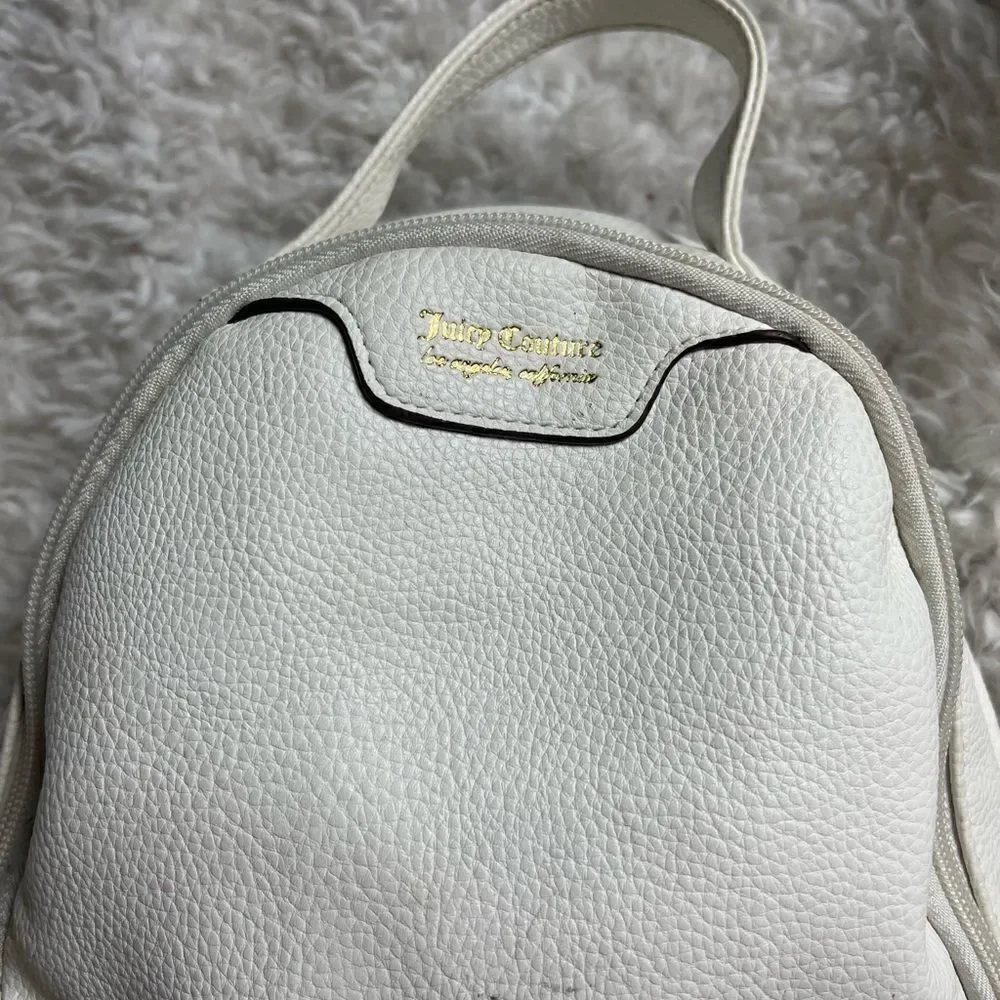 Juicy Couture white faux leather small backpack  black straps &gold tone studs